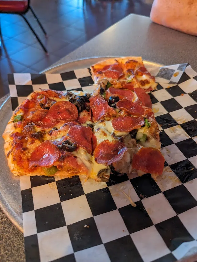 Sausage Pepperoni Green Pepper and Onion Pizza
